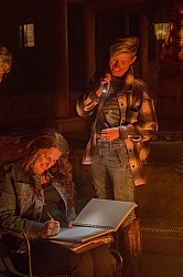 Julie signs a picture