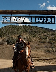 Shawn and Luke under the C Lazy U Entrance sign