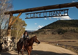 Shawn and Luke under the C Lazy U Entrance sign
