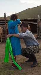 Baagii ties the Sash on his grandaighter Buggins Deel