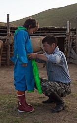 Baagii ties the Sash on his grandaighter Buggins Deel