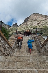 Baagii and Bugiin climb the Stairs to the Monastery