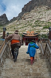 Baagii and Bugiin climb the Stairs to the Monastery