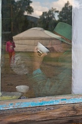 Through the Window One of Our Guides Sipping Milk Inside the Pri