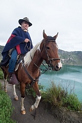 Gabriel riding around  Crater Lake at Quilotoa volcano