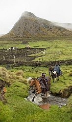 Gabriel crossing a river in the high Andes