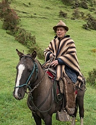 Angel on his horse at  his farm in the high Andes, Ecuador