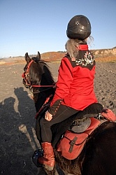 Lari Shea of Ricochet Ridge Ranch riding on the beach