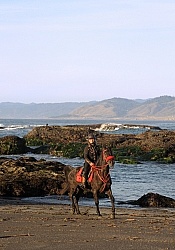 Lari Shea of Ricochet Ridge Ranch riding on the beach