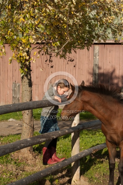 Foal Behind Wood Fencing