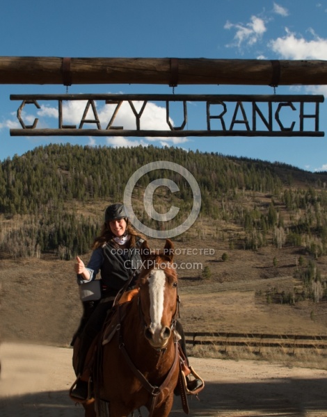 Shawn and Luke under the C Lazy U Entrance sign