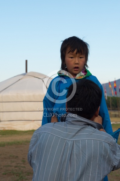 Baagii ties the Sash on his grandaighter Buggins Deel