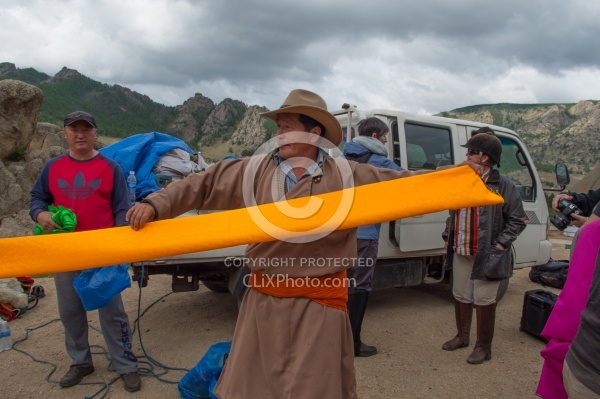 Baagii Preparing a Sash for A Deel