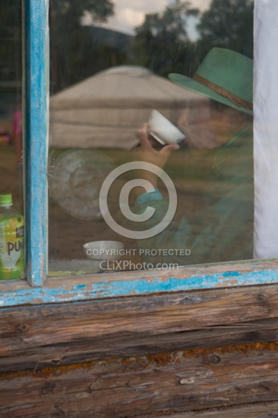 Through the Window One of Our Guides Sipping Milk Inside the Pri