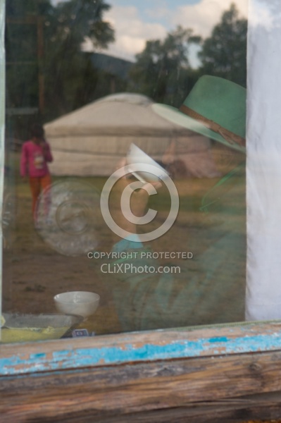 Through the Window One of Our Guides Sipping Milk Inside the Pri