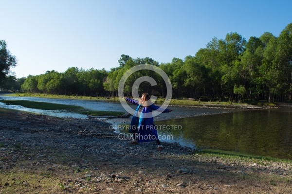 Shawn stretching by the river