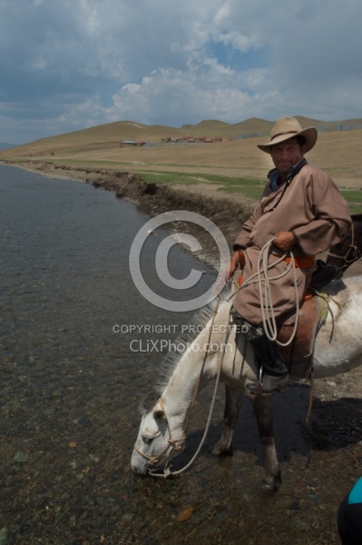Baagii lets his horse have a drink