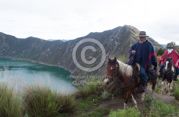 Gabriel and Rodrigo riding around  Crater Lake at Quilotoa volca