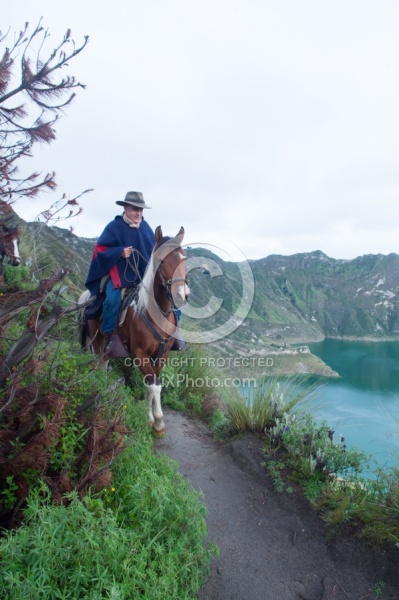 Gabriel a riding around  Crater Lake at Quilotoa volcano