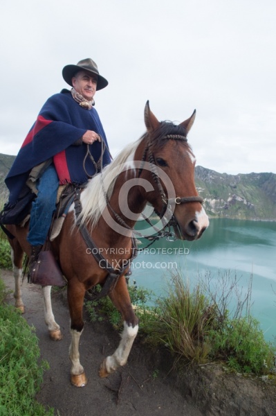 Gabriel riding around  Crater Lake at Quilotoa volcano