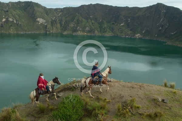 Gabriel and Rodrigo riding around  Crater Lake at Quilotoa volca