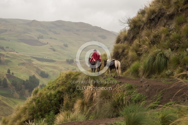 Rodrigo follows the trail on the mountain edge.
