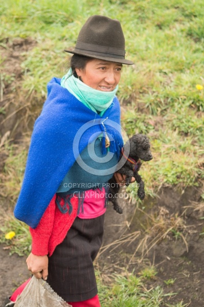 Ecuadorian Woman Carrying a Puppy