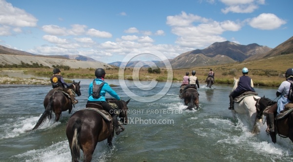 Riding through a  River in Ahuriri Conservation Area New Zealand , Wild Women Expeditions with Adventure Horse Trekking New Zealand 