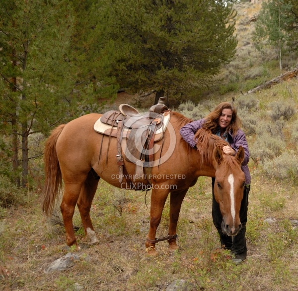 Shawn with her Horse Hobbled at Blue Sky Sage Horse Adventures