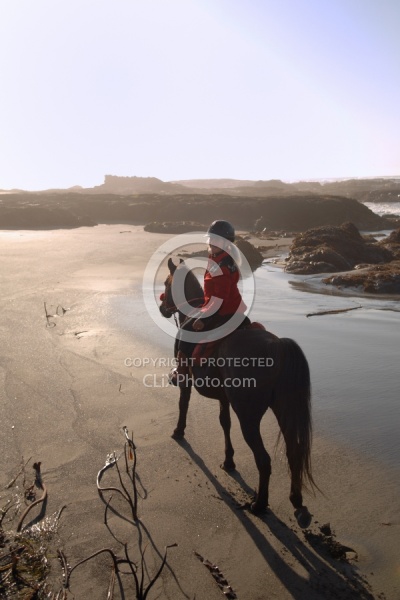 Lari Shea of Ricochet Ridge Ranch riding on the beach