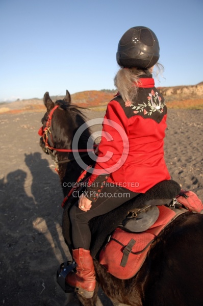 Lari Shea of Ricochet Ridge Ranch riding on the beach