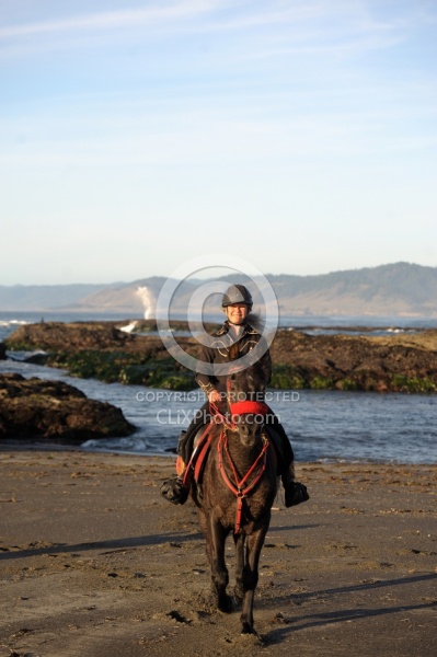 Lari Shea of Ricochet Ridge Ranch riding on the beach