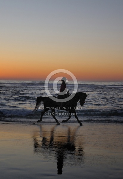 Riding on the beach at Sunset at Ricochet Ridge Ranch