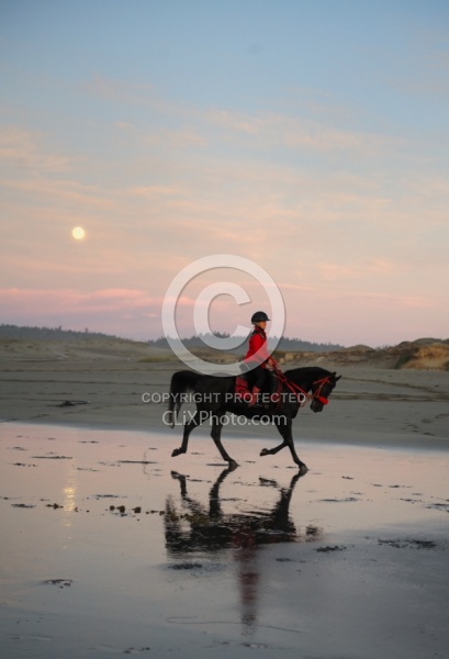 Riding on the beach at Sunset at Ricochet Ridge Ranch