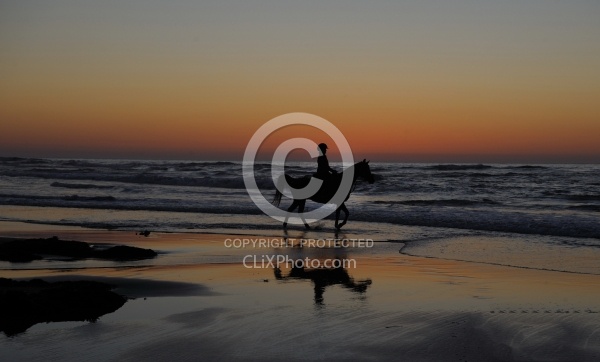 Riding on the beach at Sunset at Ricochet Ridge Ranch