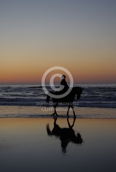 Riding on the beach at Sunset at Ricochet Ridge Ranch