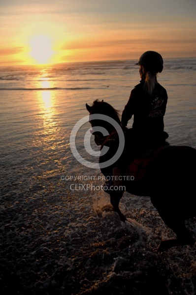 Riding on the beach at Sunset at Ricochet Ridge Ranch