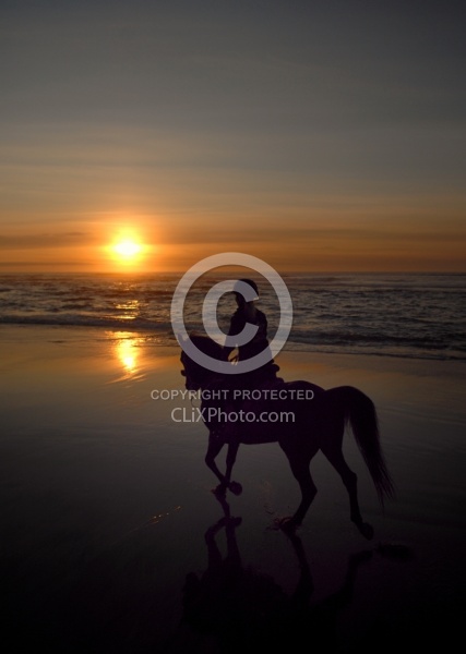 Riding on the beach at Sunset at Ricochet Ridge Ranch